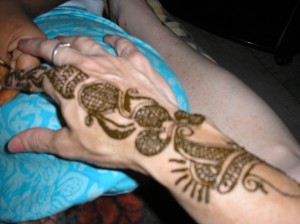 Rehka putting Henna on my hand